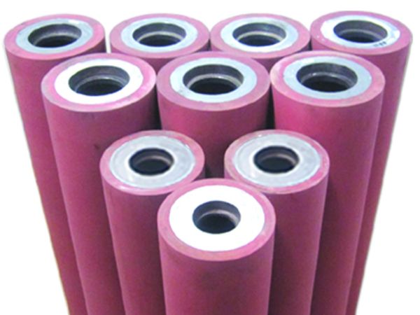 Stack of pink flexible printing rollers